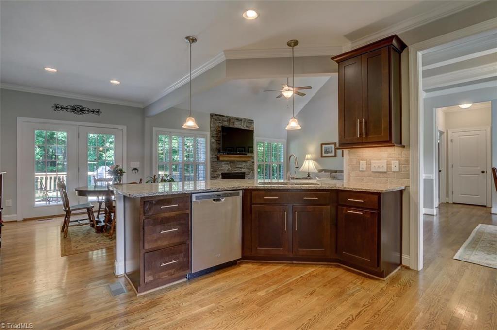 7772 Sutter Road Greensboro, NC 27455 - Photo 11 of 30 Beautiful cabinets offer plenty of storage!