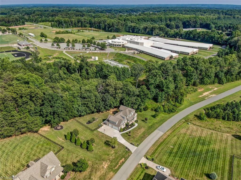 7772 Sutter Road Greensboro, NC 27455 - Photo 29 of 30 The way this house is situated on the lot offer maximum privacy and open space! View of Northern Middle School.