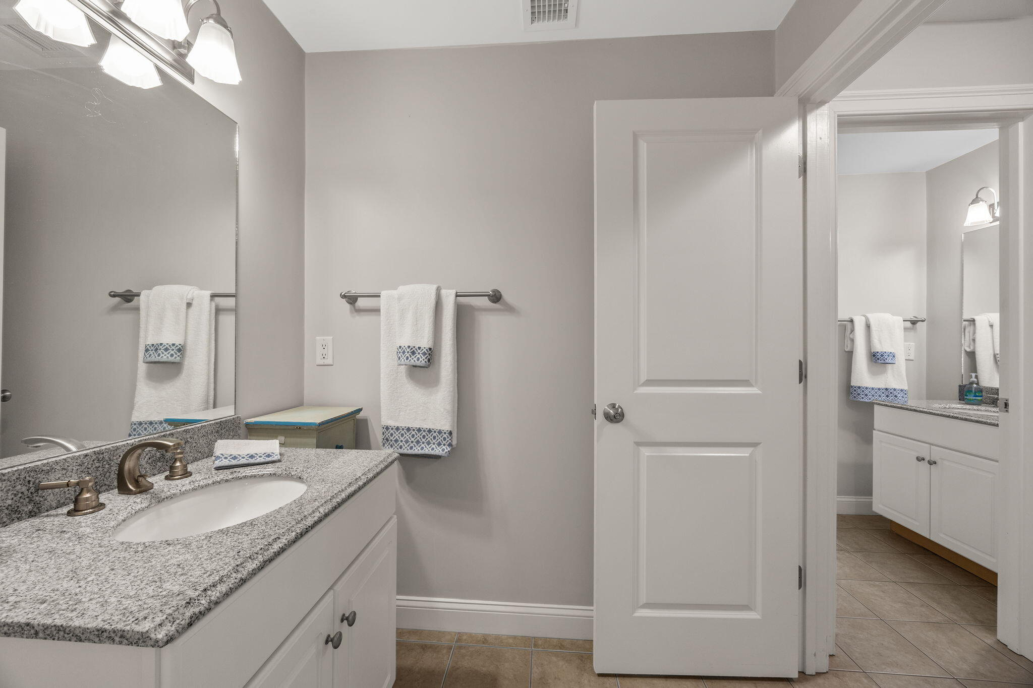 17 Payamps Road Mashpee, MA 02649 - Photo 53 of 72 a bathroom with a granite countertop sink and a mirror
