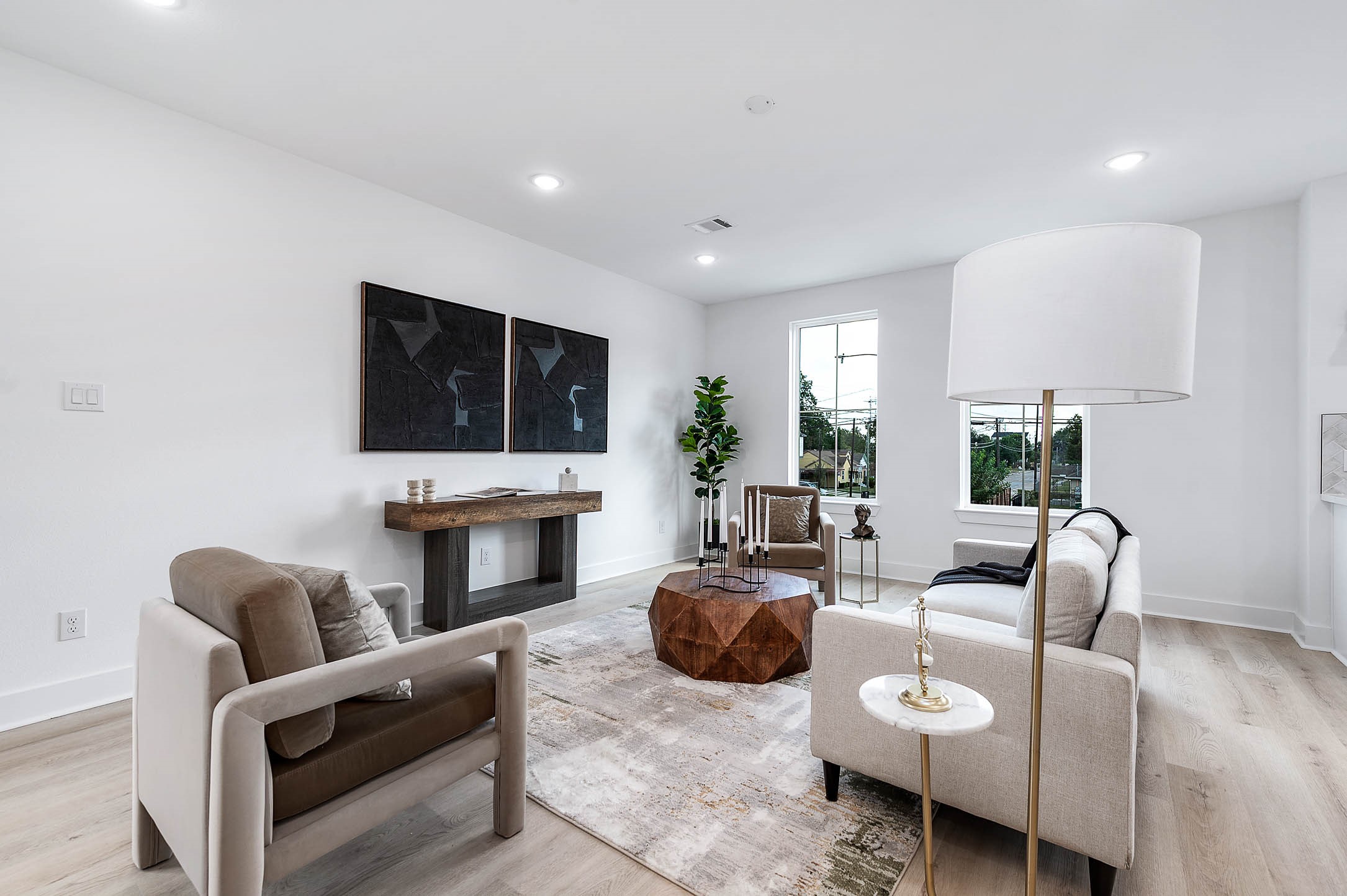 1515 Euel Street Houston, TX 77009 - Photo 11 of 34 Elegant living space highlighted by a sleek accent wall and contemporary fireplace feature—perfect for relaxing evenings.