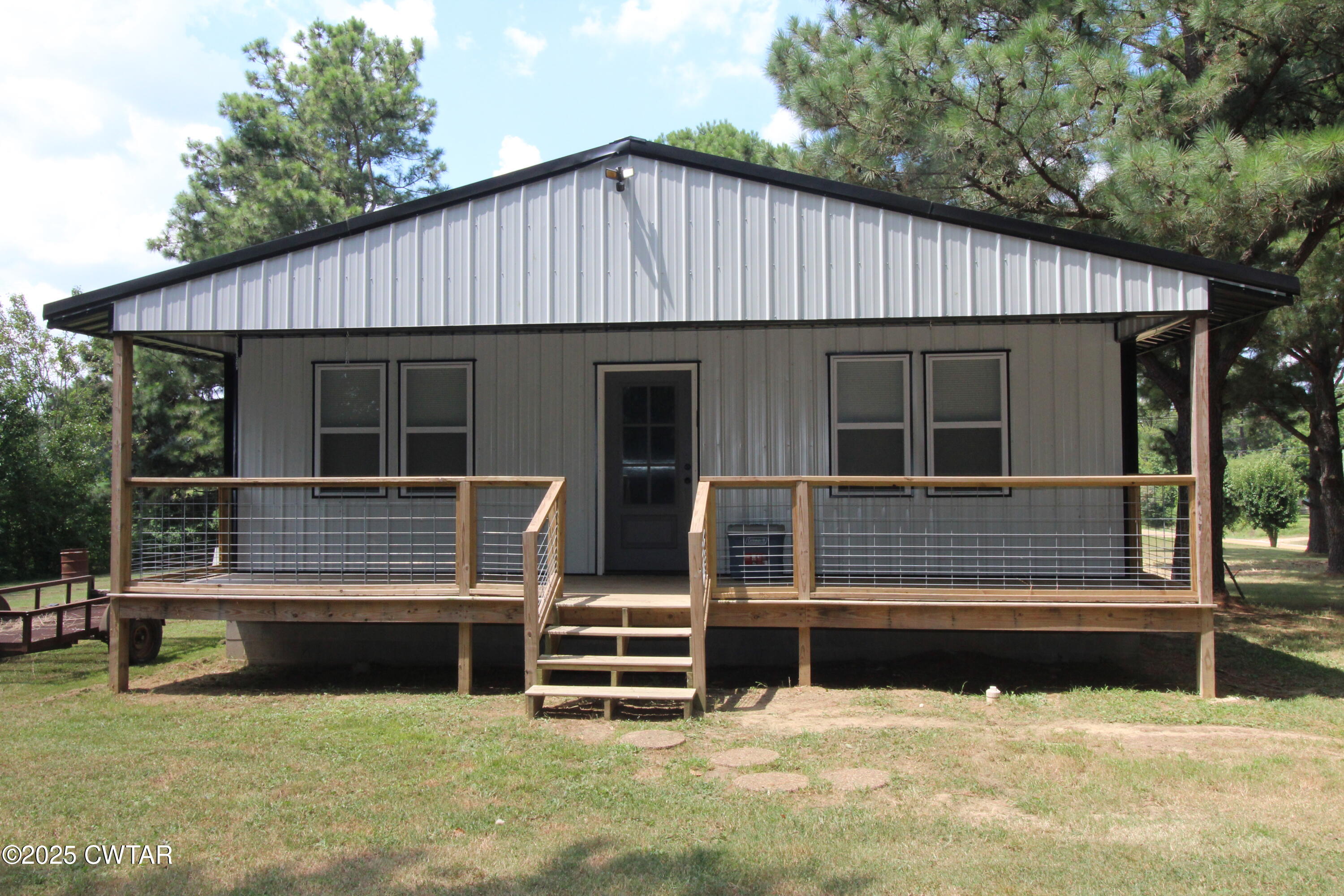 2983-2985 Sidonia Road Sharon, TN 38255 - Photo 2 of 4 a front view of a house with a yard
