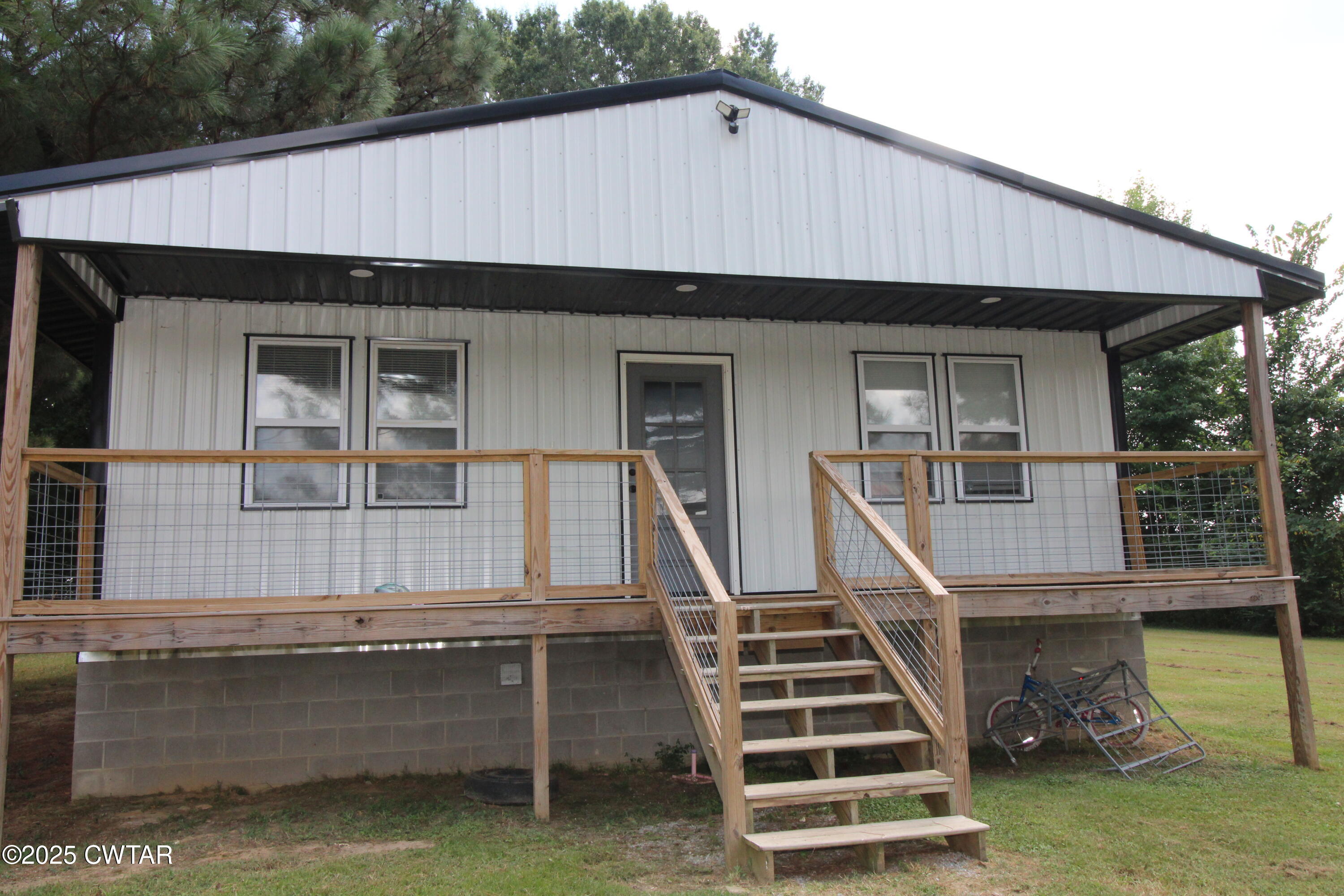 2983-2985 Sidonia Road Sharon, TN 38255 - Photo 3 of 4 a front view of a house with a yard
