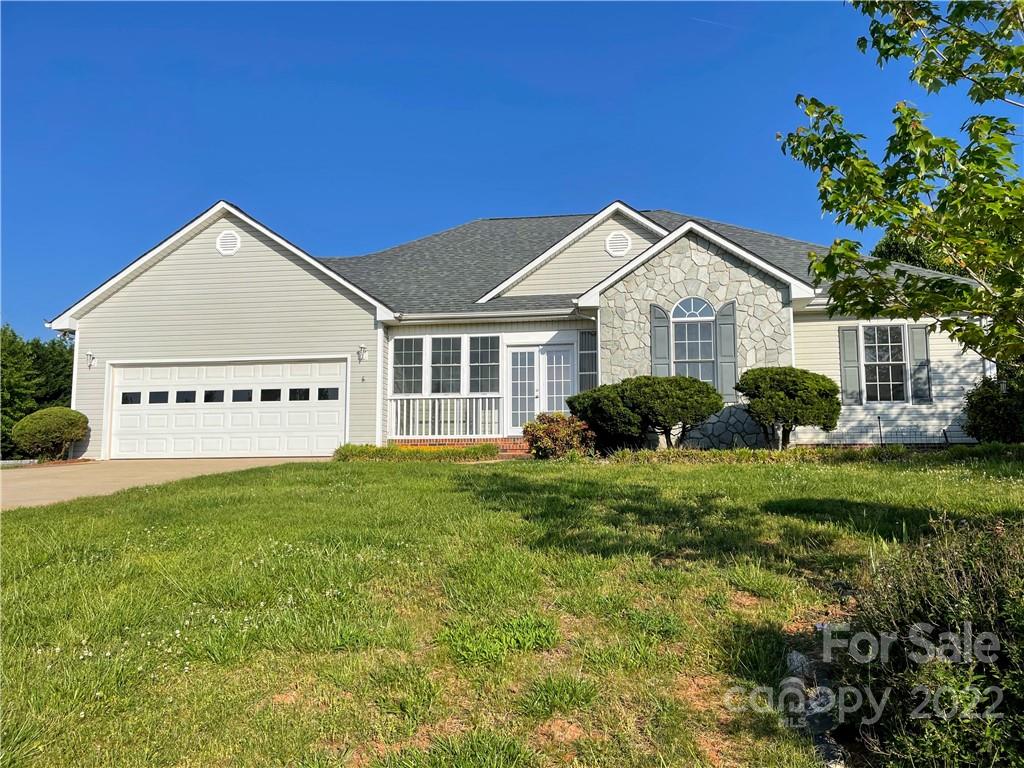 181 Hunters Trace Rutherfordton, NC 28139 - Photo 1 of 15 a view of a house with a yard and potted plants