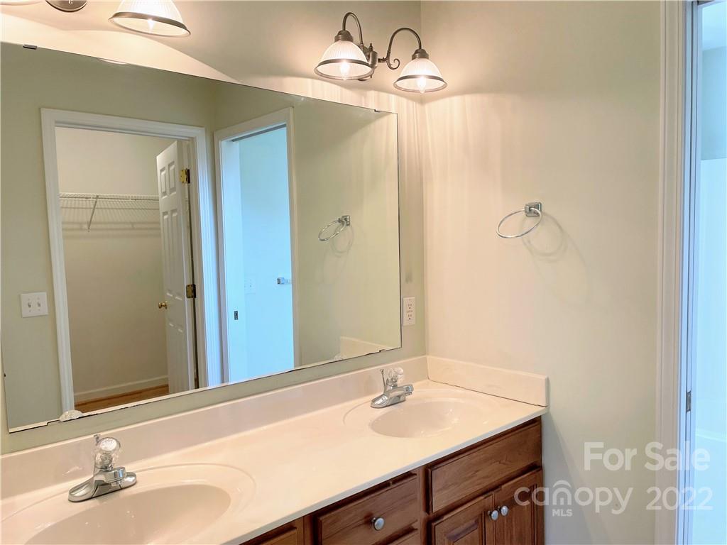 181 Hunters Trace Rutherfordton, NC 28139 - Photo 11 of 15 a bathroom with a sink and a mirror