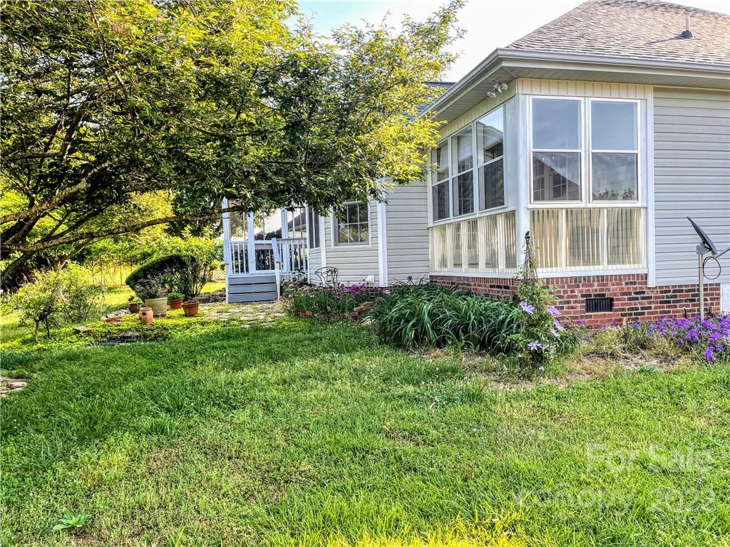 181 Hunters Trace Rutherfordton, NC 28139 - Photo 15 of 15 a view of a house with a yard and sitting area