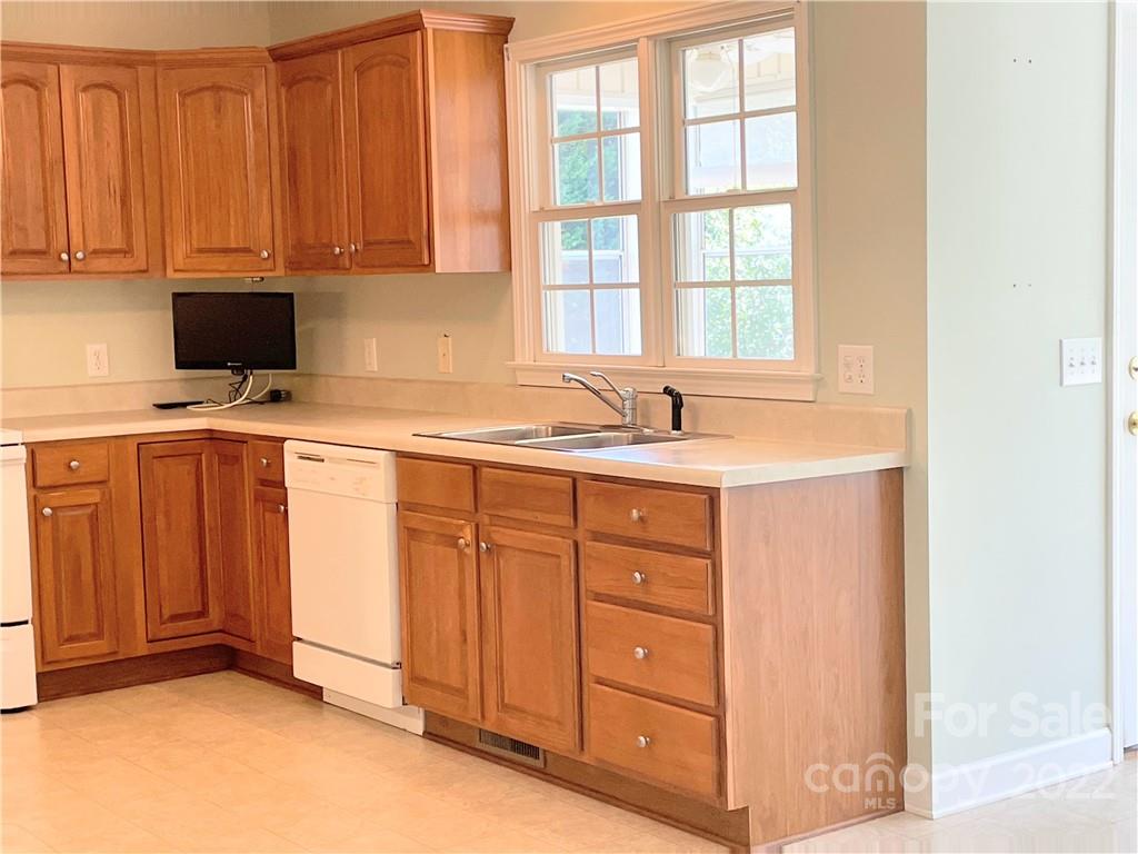181 Hunters Trace Rutherfordton, NC 28139 - Photo 7 of 15 a kitchen with a sink and cabinets
