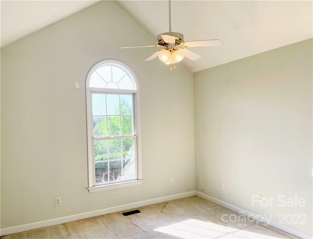181 Hunters Trace Rutherfordton, NC 28139 - Photo 10 of 15 an empty room with a window