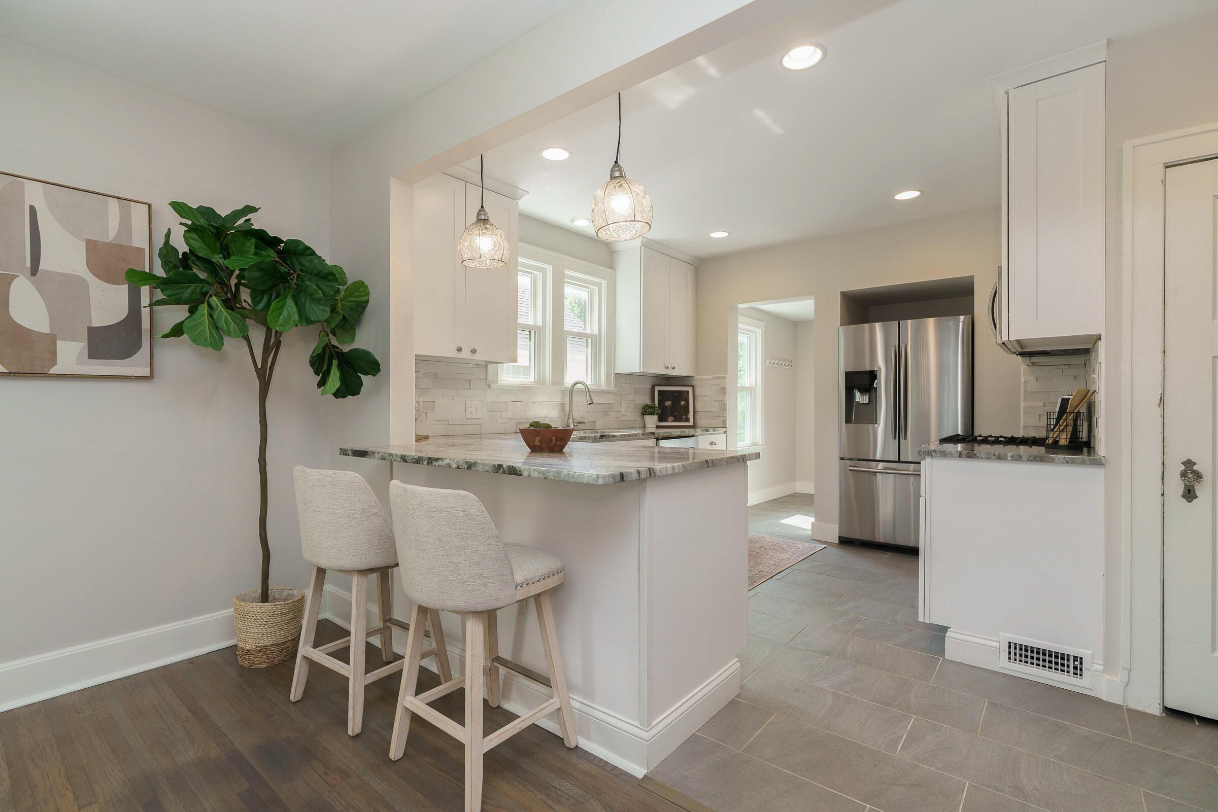 163 Garden Road Columbus, OH 43214 - Photo 14 of 46 The granite peninsula is a perfect perch for breakfast or weeknight meal prep to keep the home cook company.