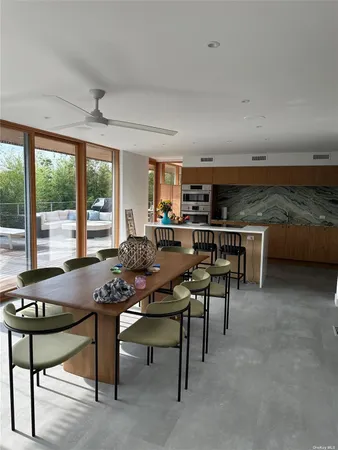 a view of a dining room with furniture window and outside view