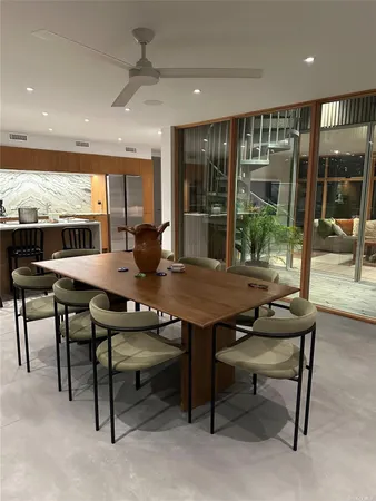 a view of a dining room with furniture window and outside view