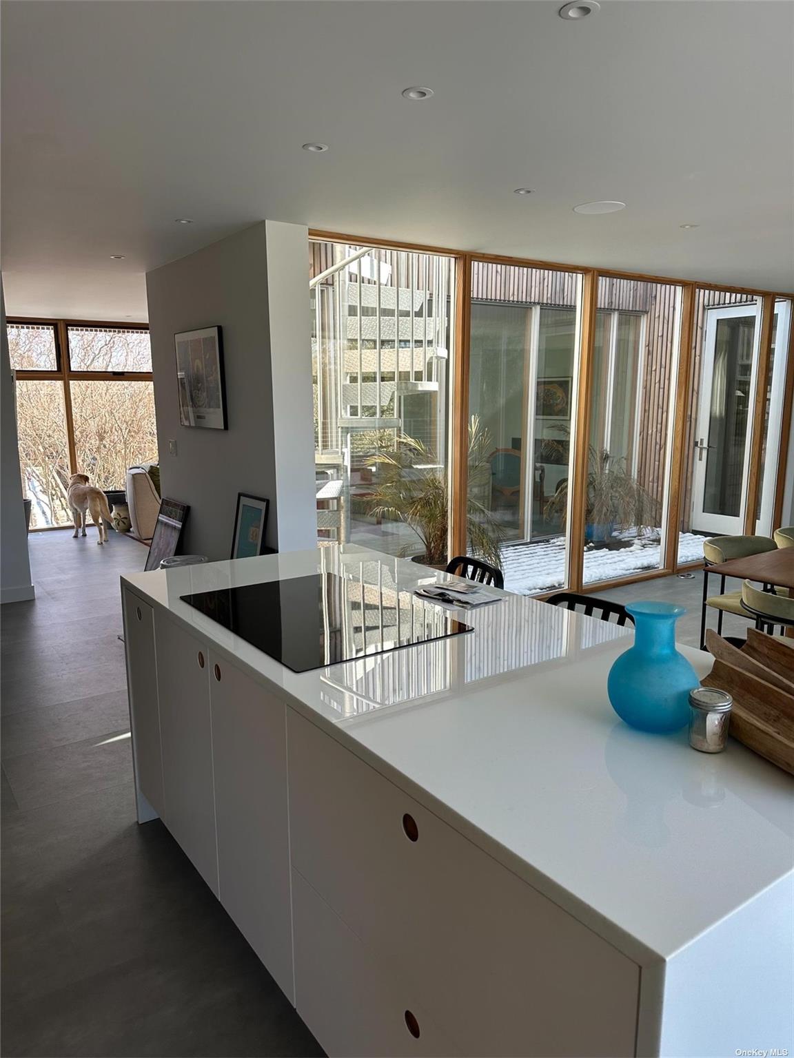 25 Sloop Walk Ocean Beach, NY 11770 - Photo 4 of 11 a living room with furniture and large windows