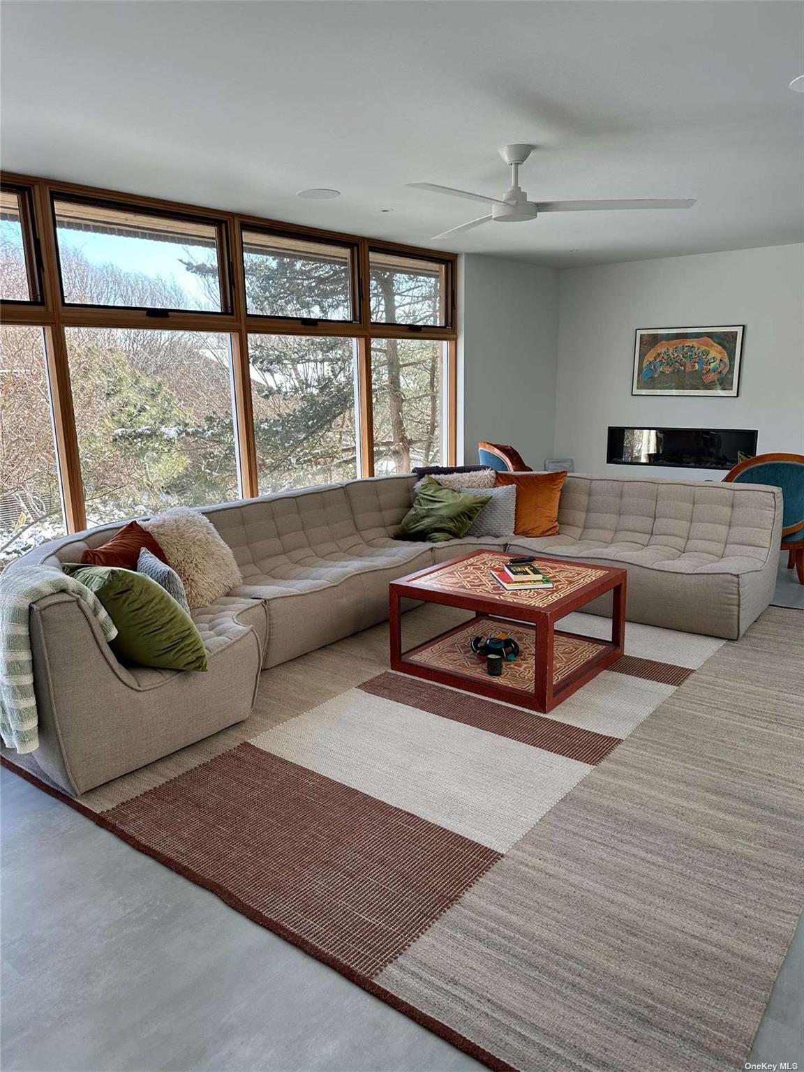25 Sloop Walk Ocean Beach, NY 11770 - Photo 5 of 11 a living room with furniture and a large window
