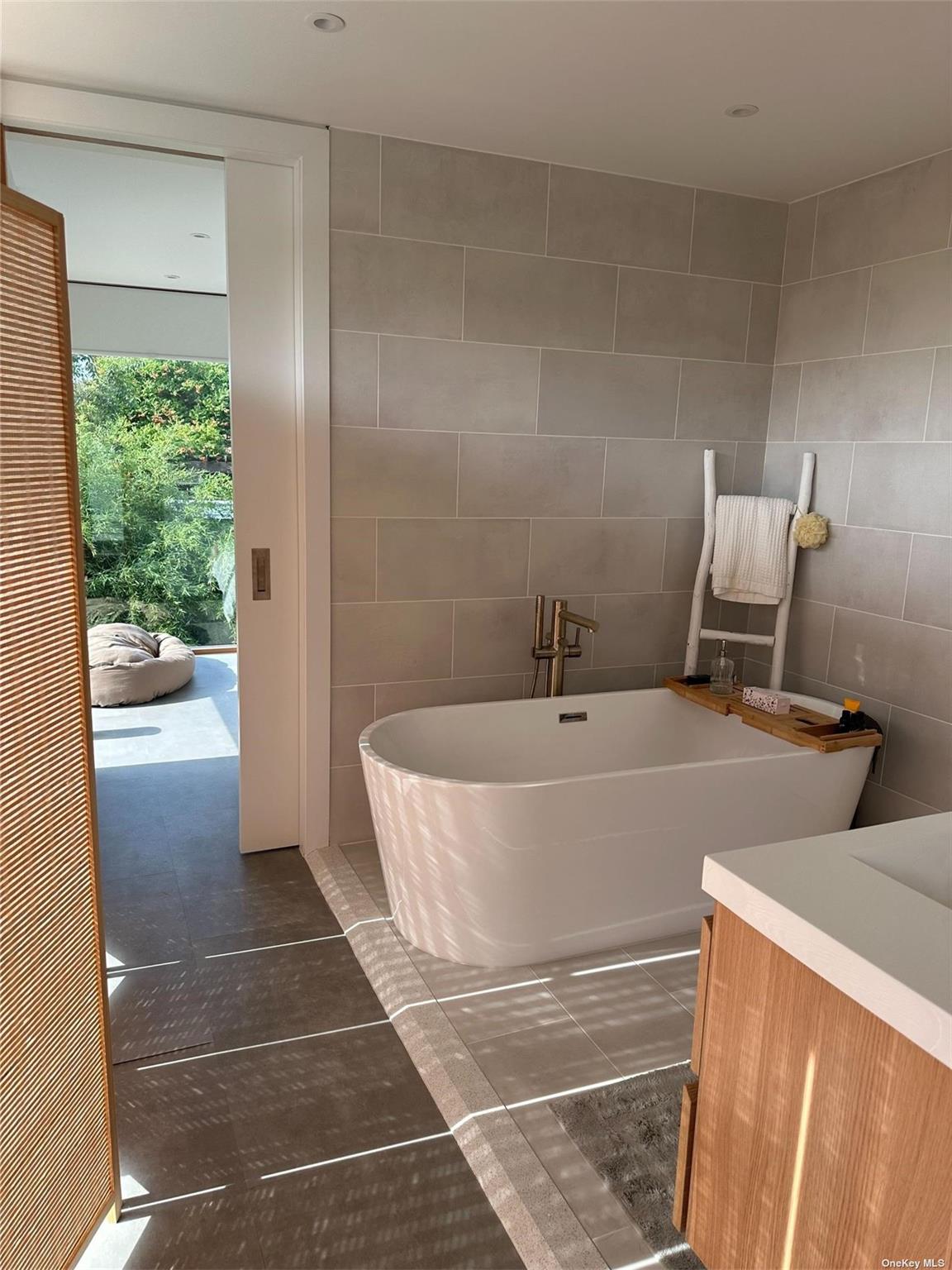 25 Sloop Walk Ocean Beach, NY 11770 - Photo 9 of 11 a bathroom with a tub and shower