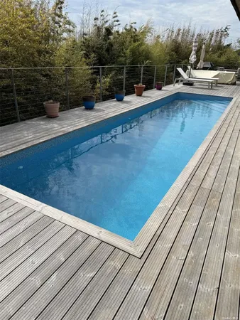 a view of roof deck with patio