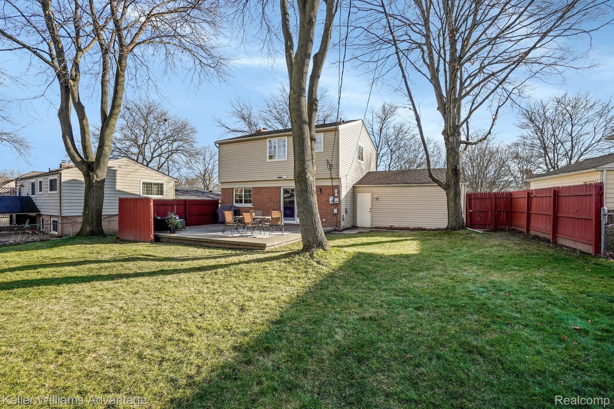 543 Reed Street Northville, MI 48167 - Photo 28 of 36 Good amount of privacy and huge yard. Extra door for easy garage access.