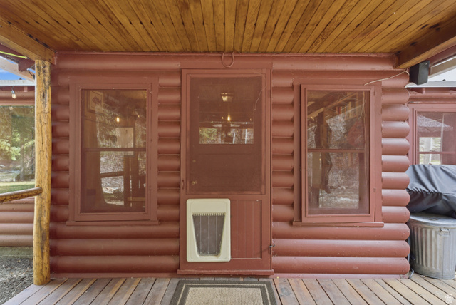 6631 Pine Springs Road Kamas, UT 84036 - Photo 45 of 48 View of exterior entry with heating unit and faux log siding