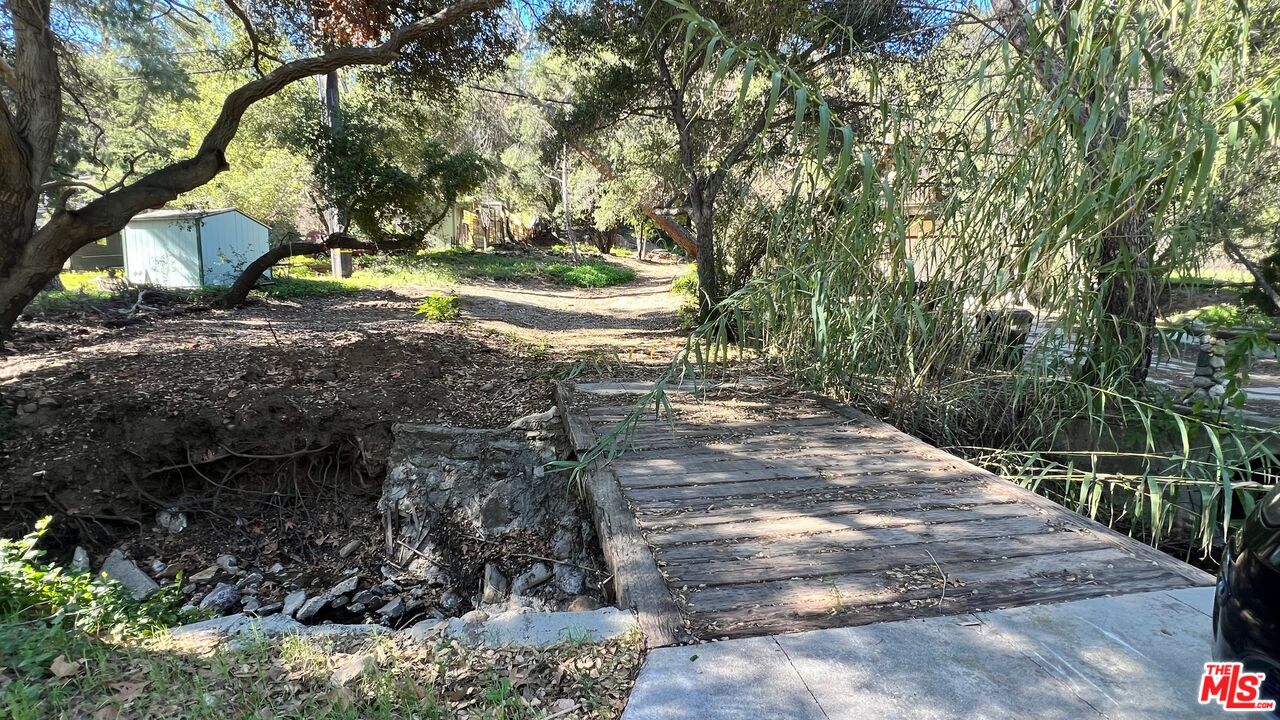 3485 Old Topanga Canyon Road Calabasas, CA 91302 - Photo 12 of 17 a view of a yard with plants and trees