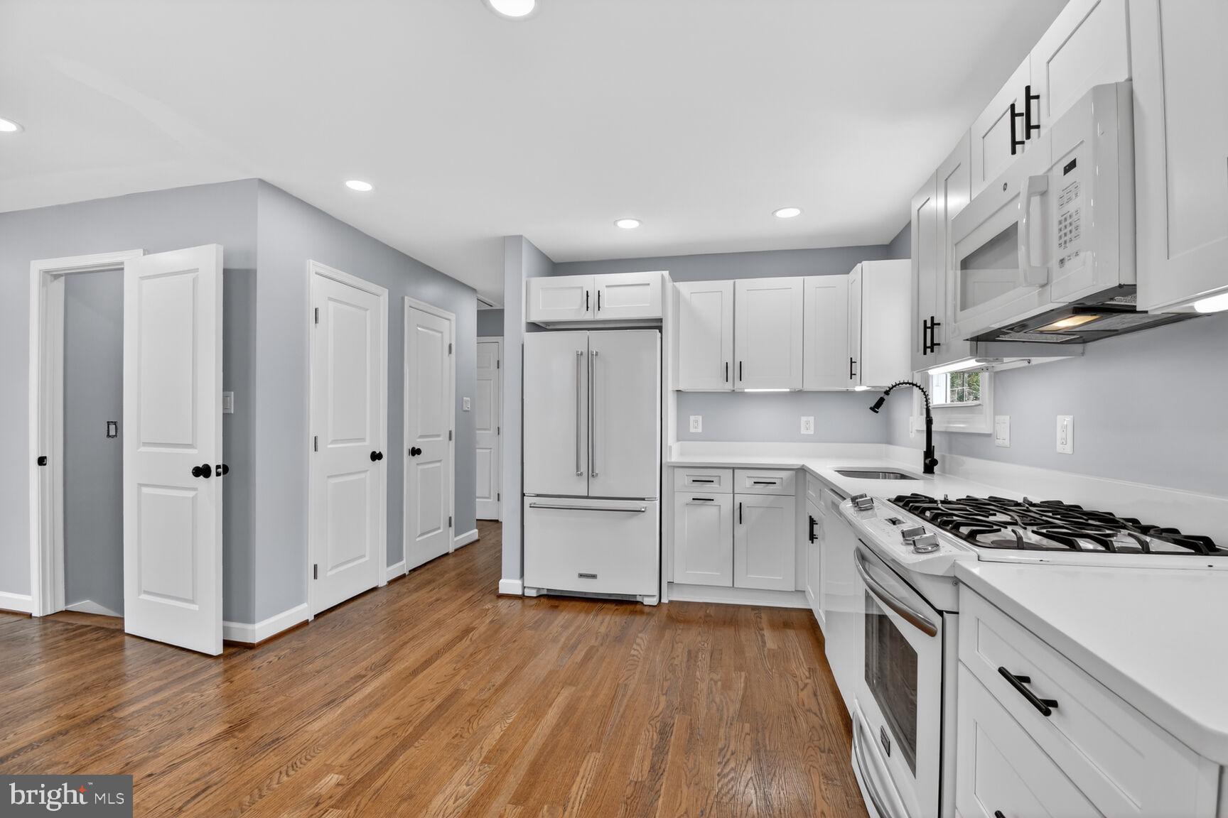 6019 Jamestown Road Hyattsville, MD 20782 - Photo 5 of 23 Modern kitchen with sleek finishes.
