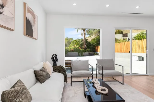 a bedroom with a large bed and a couch