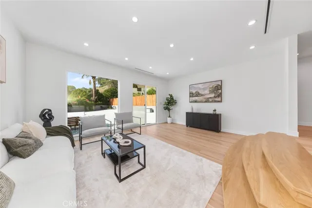 a bedroom with a bed chair and a window