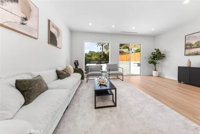 a bedroom with a bed and a night stand