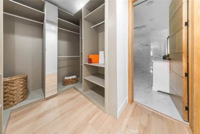 a large white bed in a white room