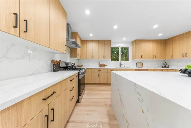 a kitchen with counter space dining table and chairs