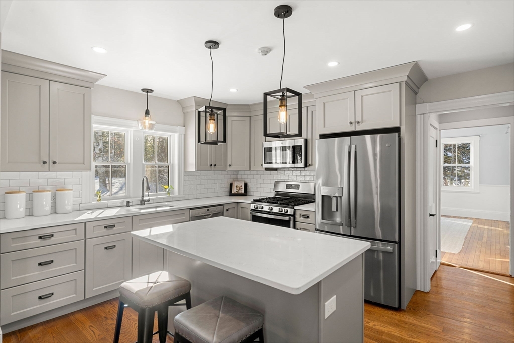 201 Main Street Rowley, MA 01969 - Photo 13 of 42 a kitchen that has a cabinets a sink appliances and cabinets