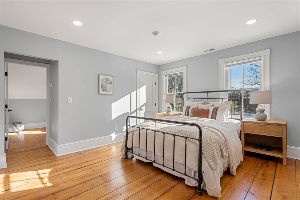201 Main Street Rowley, MA 01969 - Photo 22 of 42 a bedroom with a bed and wooden floor