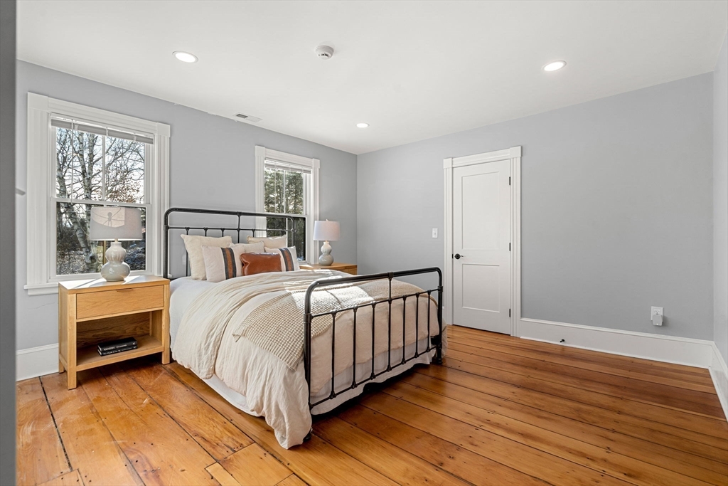 201 Main Street Rowley, MA 01969 - Photo 23 of 42 a bedroom with a bed and a night stand