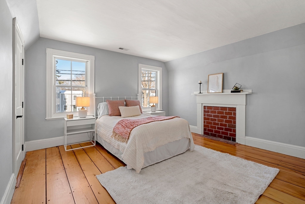 201 Main Street Rowley, MA 01969 - Photo 25 of 42 a bedroom with a bed and a dresser