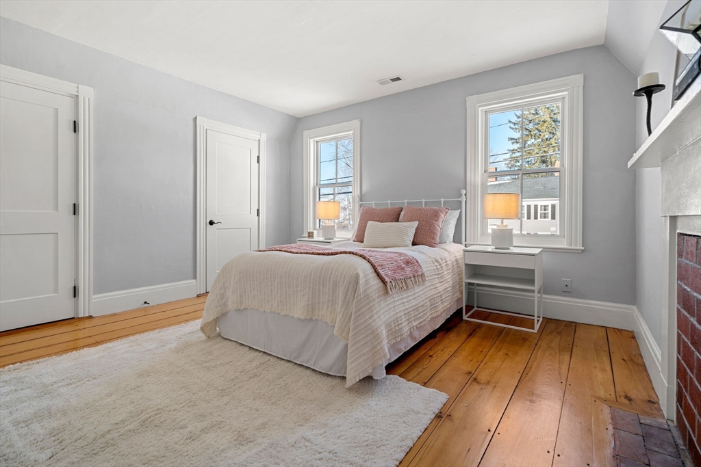 201 Main Street Rowley, MA 01969 - Photo 26 of 42 a bedroom with a bed and windows