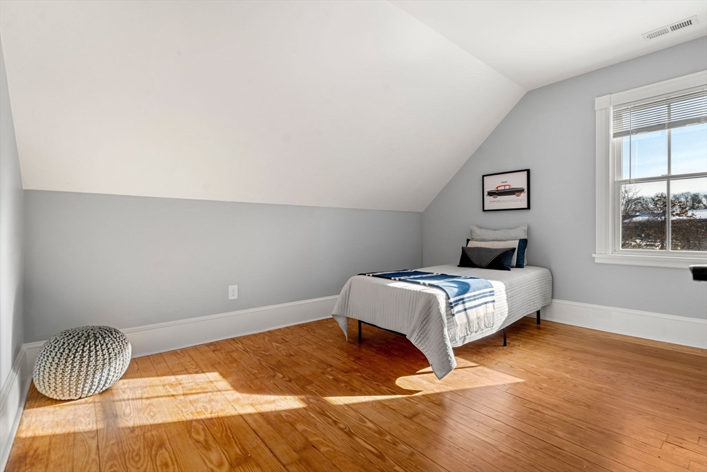 201 Main Street Rowley, MA 01969 - Photo 27 of 42 a bedroom with a bed and a window