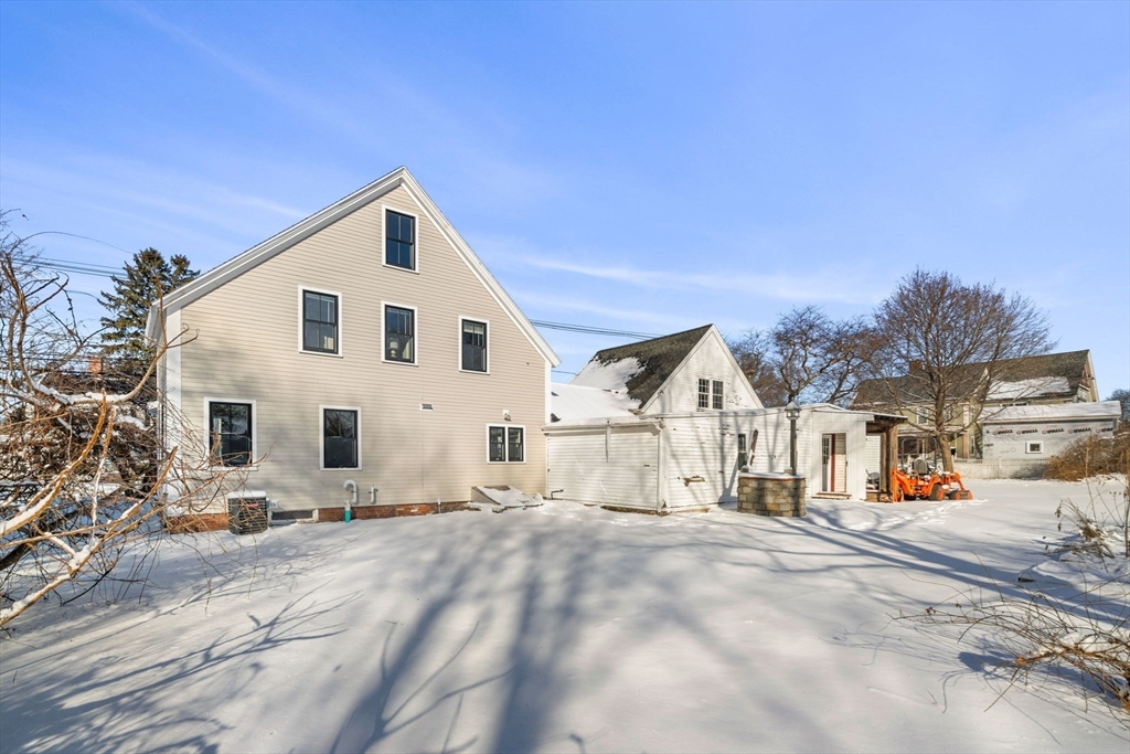 201 Main Street Rowley, MA 01969 - Photo 35 of 42 a view of a white house with a yard