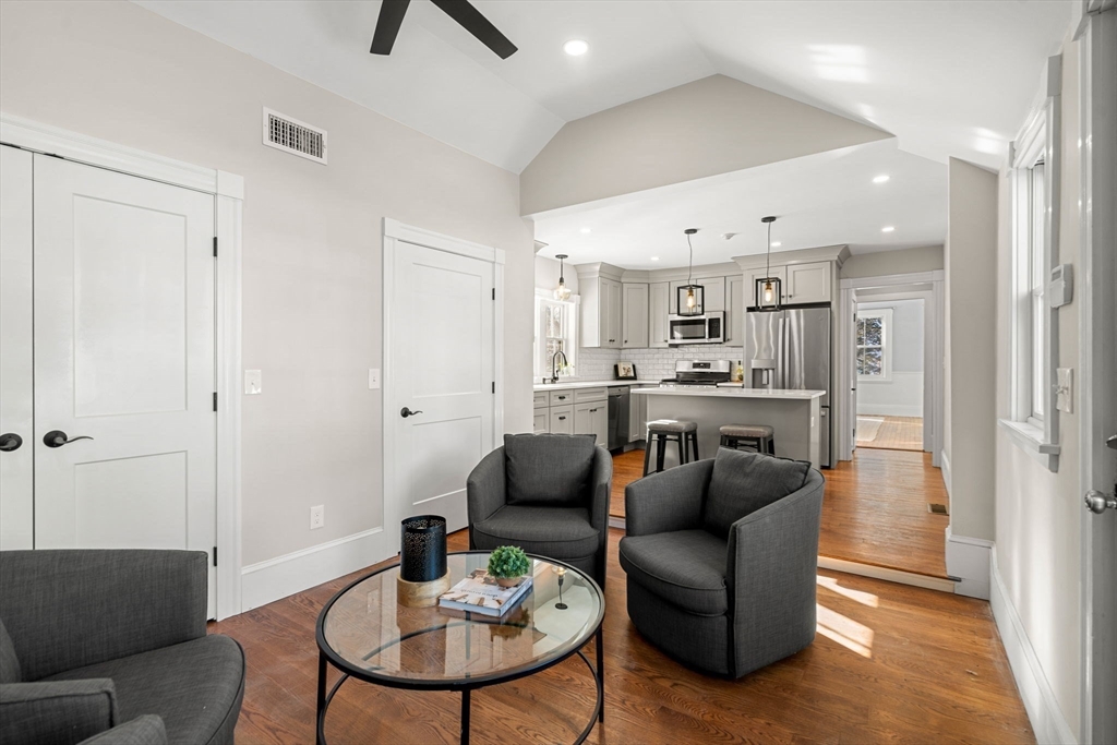 201 Main Street Rowley, MA 01969 - Photo 8 of 42 a living room with stainless steel appliances kitchen island granite countertop furniture and a view of kitchen