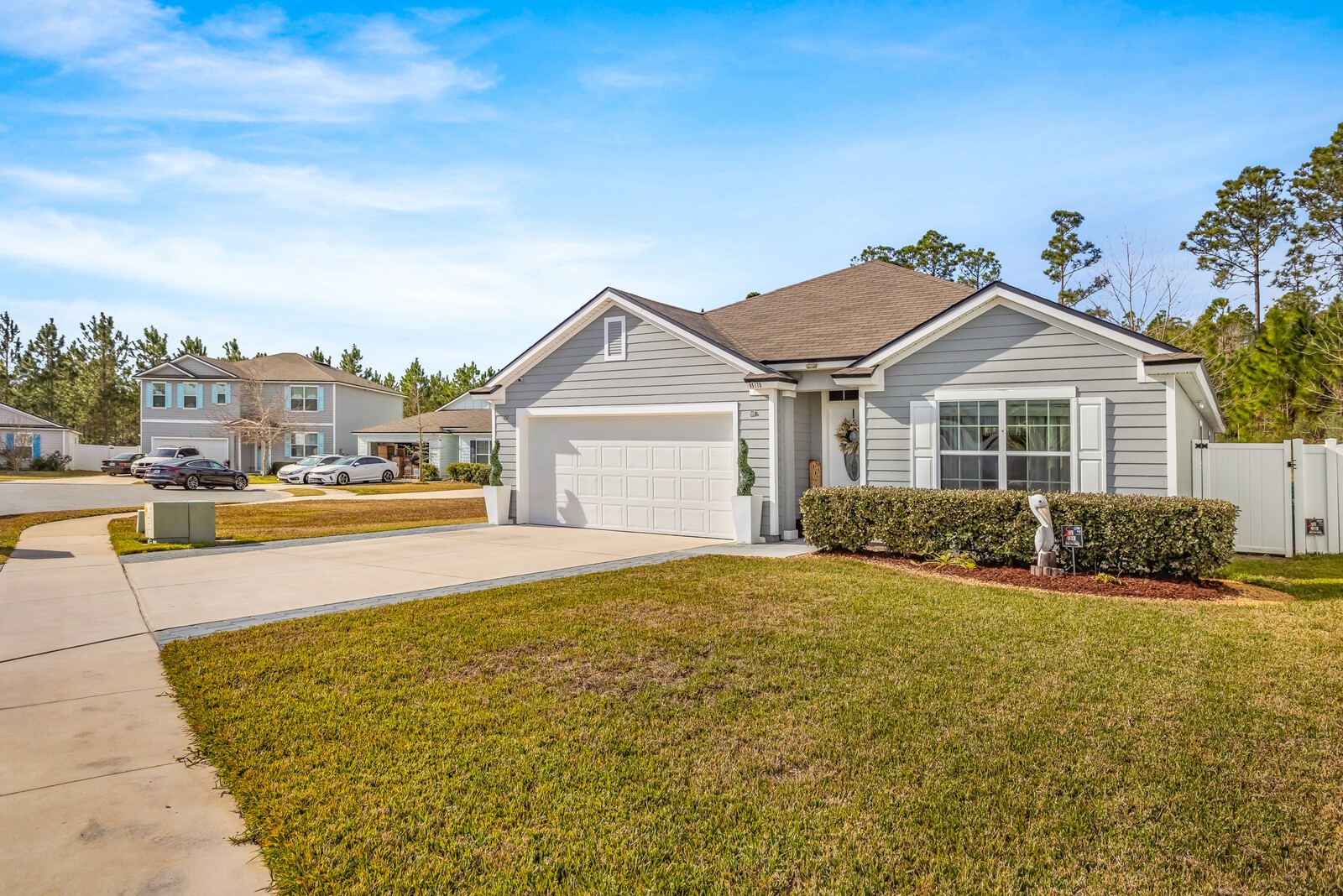 95170 Timberlake Drive Fernandina Beach, FL 32034 - Photo 1 of 36 a front view of a house with a yard