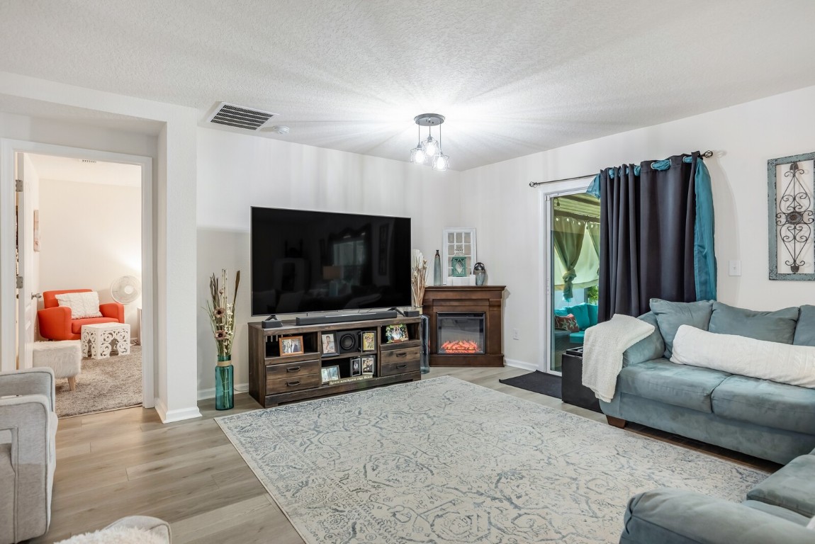 95170 Timberlake Drive Fernandina Beach, FL 32034 - Photo 5 of 36 a living room with furniture and a flat screen tv