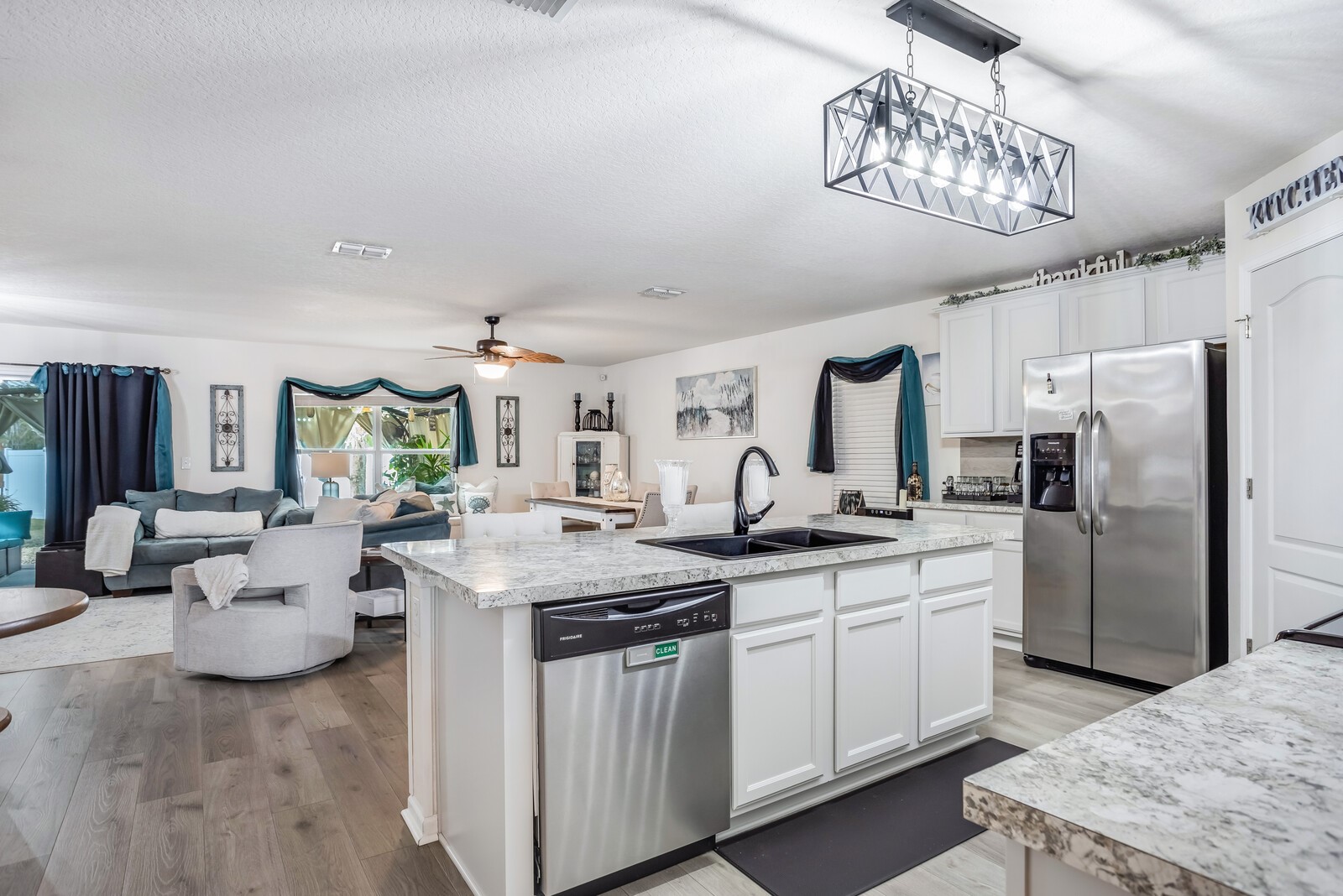 95170 Timberlake Drive Fernandina Beach, FL 32034 - Photo 9 of 36 a kitchen with stainless steel appliances granite countertop a sink stove and refrigerator