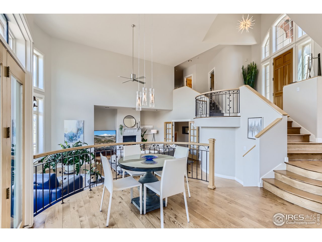 814 Mountain View Drive Lyons, CO 80540 - Photo 12 of 36 a view of a dining room with furniture and wooden floor