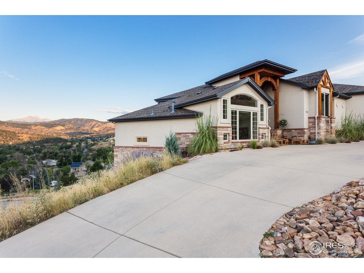 814 Mountain View Drive Lyons, CO 80540 - Photo 3 of 36 a front view of a house with a yard and garage