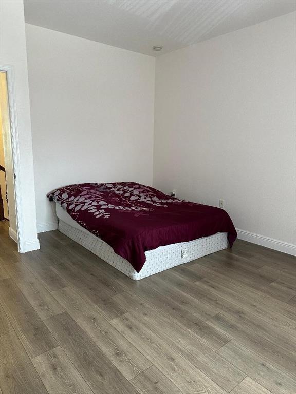 8824 Southwest 153rd Court Miami, FL 33196 - Photo 20 of 25 a bedroom with a bed and a window