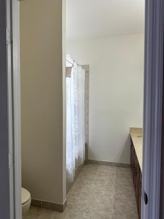 8824 Southwest 153rd Court Miami, FL 33196 - Photo 21 of 25 a view of a bathroom with a sink and a toilet