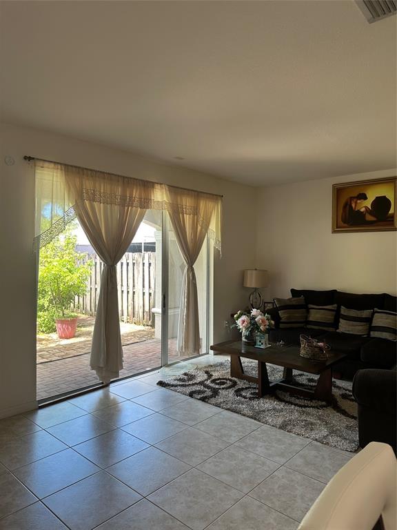 8824 Southwest 153rd Court Miami, FL 33196 - Photo 5 of 25 a living room with furniture and a fireplace