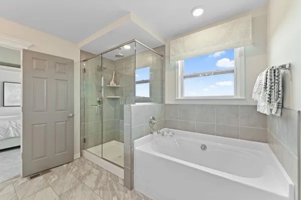 a bedroom with a bed and a couch