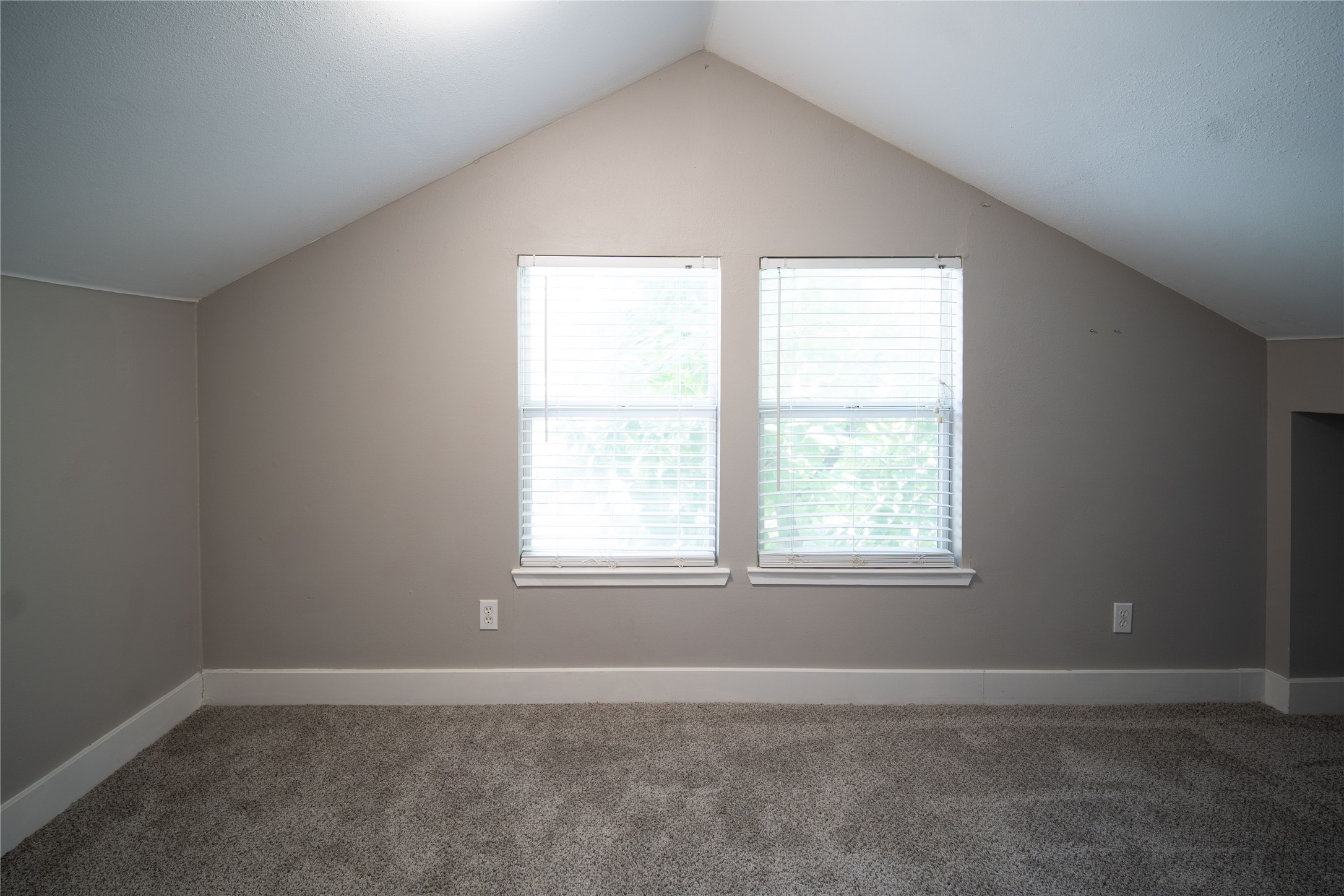 711 Graham Place, Unit B Austin, TX 78705 - Photo 5 of 13 an empty room with a window