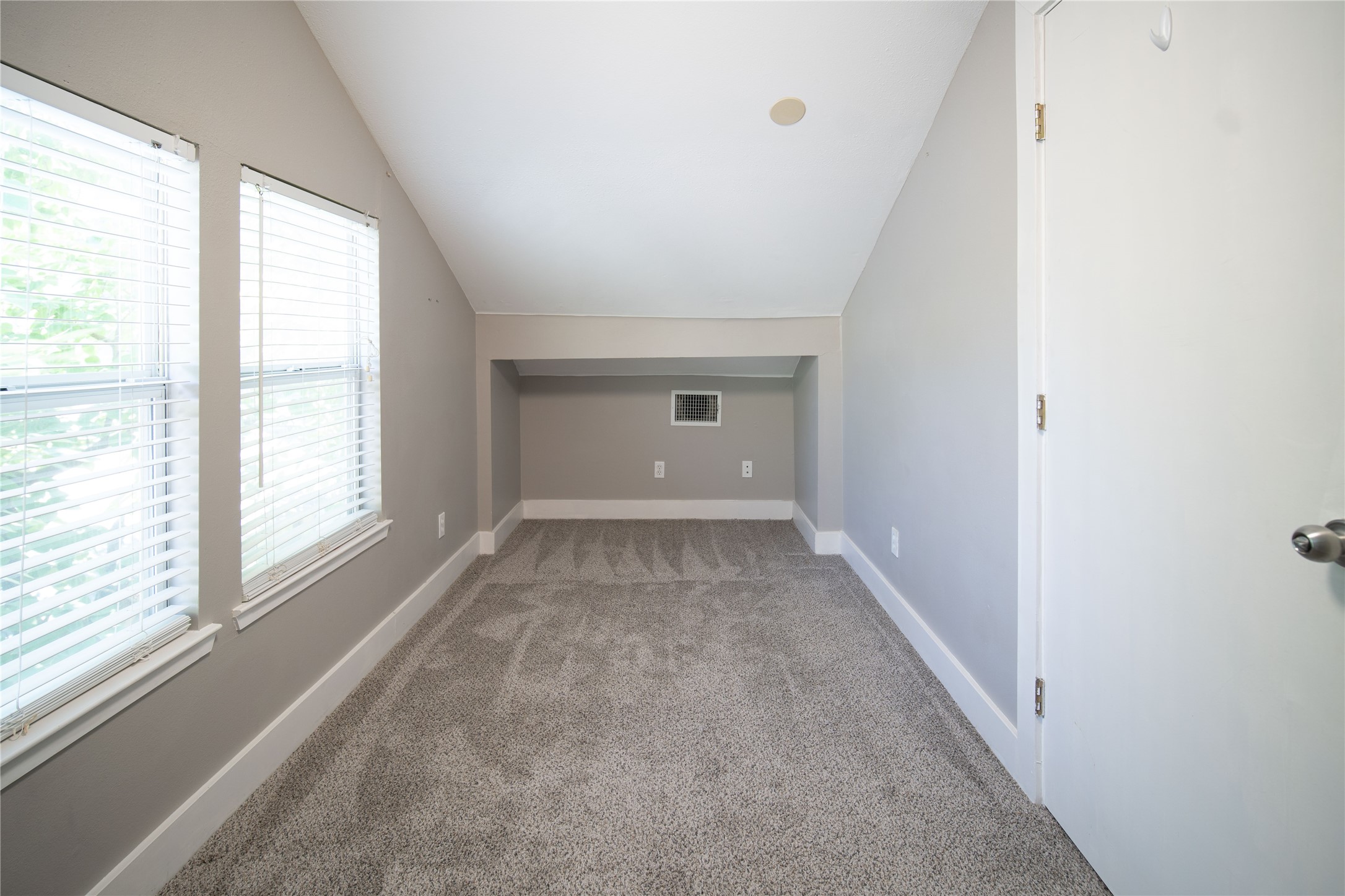 711 Graham Place, Unit B Austin, TX 78705 - Photo 6 of 13 a view of an empty room with a window