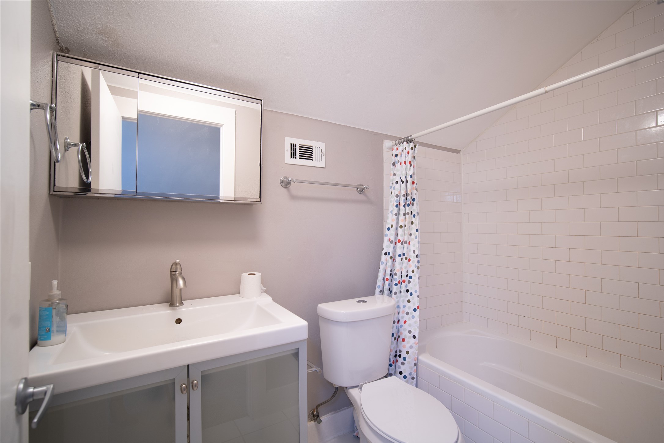 711 Graham Place, Unit B Austin, TX 78705 - Photo 7 of 13 a bathroom with a sink toilet and shower