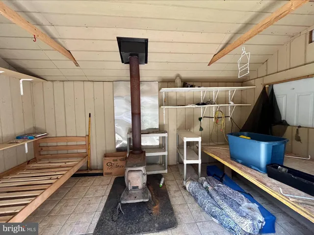 a reading room with furniture and wooden floor