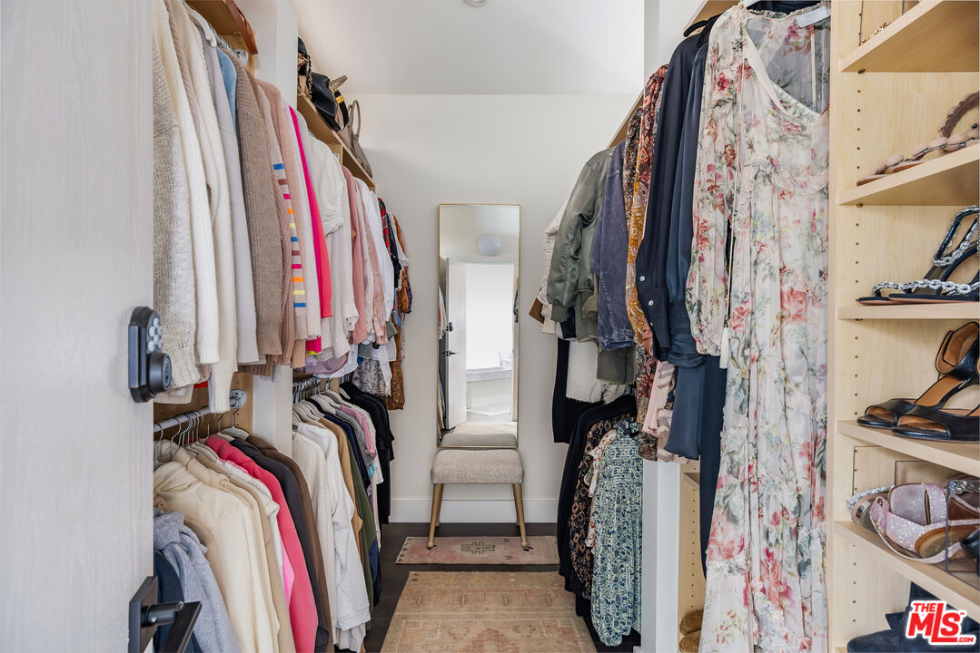 29500 Heathercliff Road, Unit 235 Malibu, CA 90265 - Photo 18 of 32 a view of walk in closet with clothes and shoes