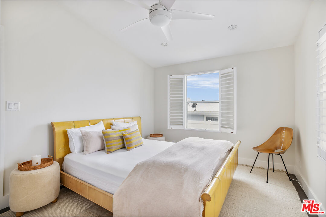 29500 Heathercliff Road, Unit 235 Malibu, CA 90265 - Photo 20 of 32 a bedroom with a bed and window